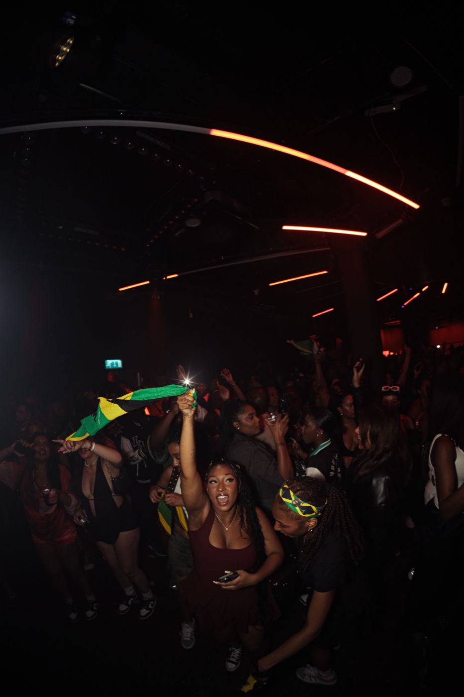 Crowd waving a Jamaican flag at City Splash